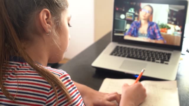 girl studying with video online lesson